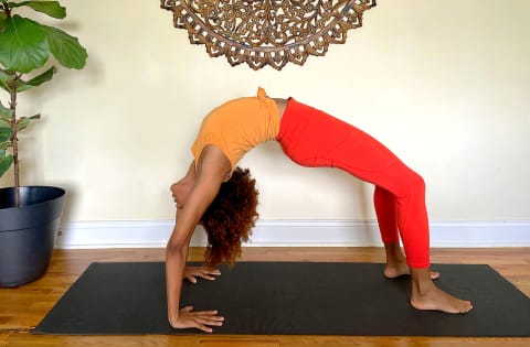 Yoga Wheel Exercises: 13 Easy Ideas