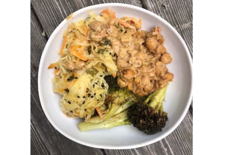 Broccoli, chickpeas and cabbage in a white bowl