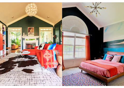 living room with multiple rugs and a bright red couch