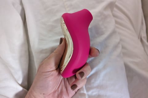 lelo sona cruise 2 in hot pink help in hand with side profile showing
