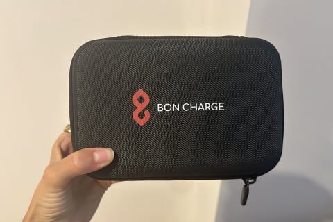 editor's hand holding bon charge mini red light case