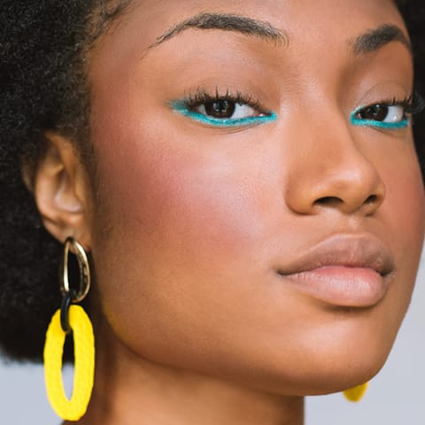 Portrait of black woman with vibrant make up