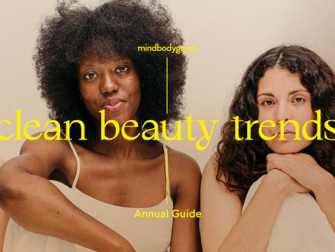 two women sitting in tan dresses on a tan background 