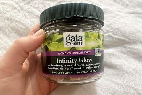 editor's hand holding Infinity glow container