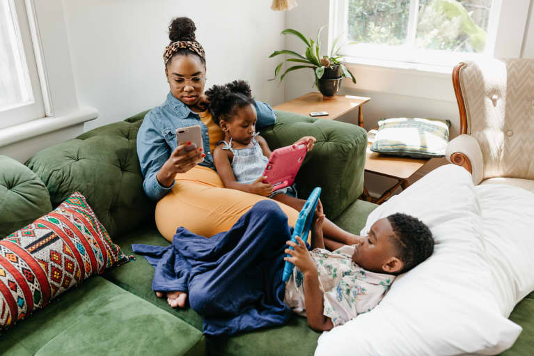 https://mindbodygreen-res.cloudinary.com/images/w_767,q_auto:eco,f_auto,fl_lossy/org/06sh3xyaukaikoxil/family-hanging-out-on-green-sofa-with-ipads-and-tabelts.jpg