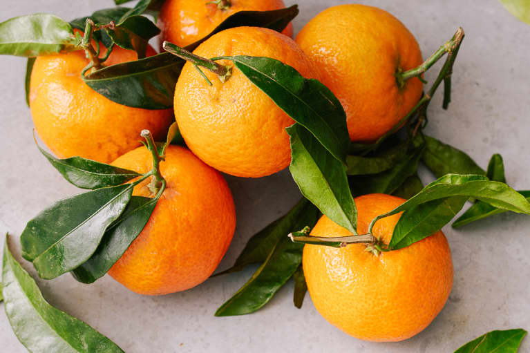 Clementines on a Stone Surface