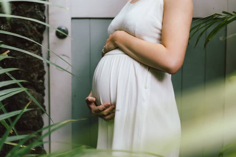 Pregnant Woman Holding Her Baby Bump