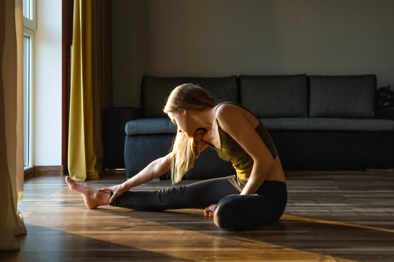 Young Woman Meditating at Home in the Morning