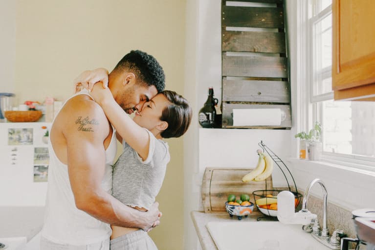 Couple Kissing in the Kitchen