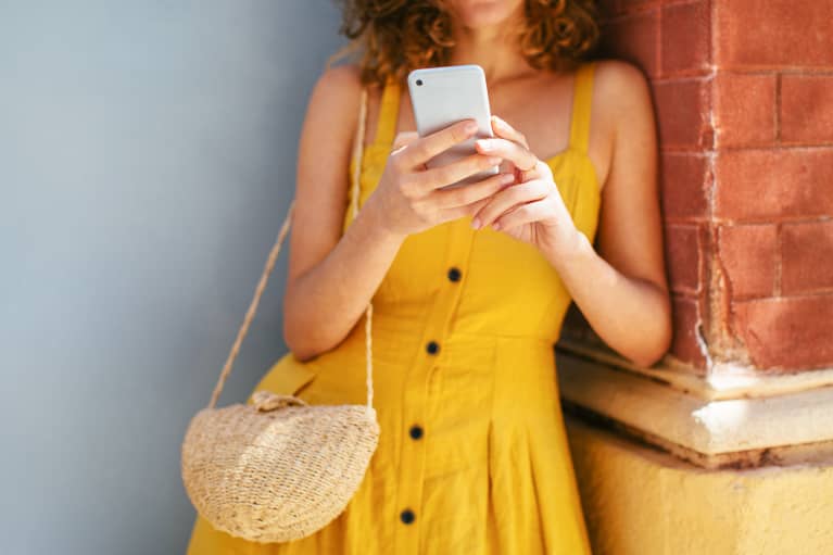Woman in a Yellow Sundress Texting Woman in a Yellow Sundress Texting