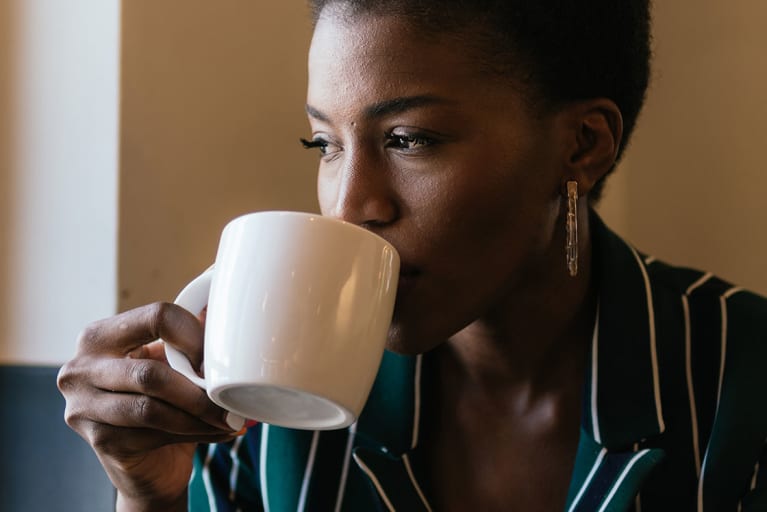 Does Putting This In Your Coffee Lead To More Youthful Skin? Here's What To Know