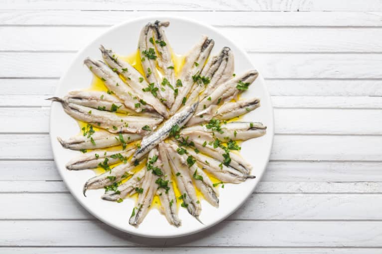 Marinated anchovies in vinegar with olive oil and parsley. Traditional spanish tapas