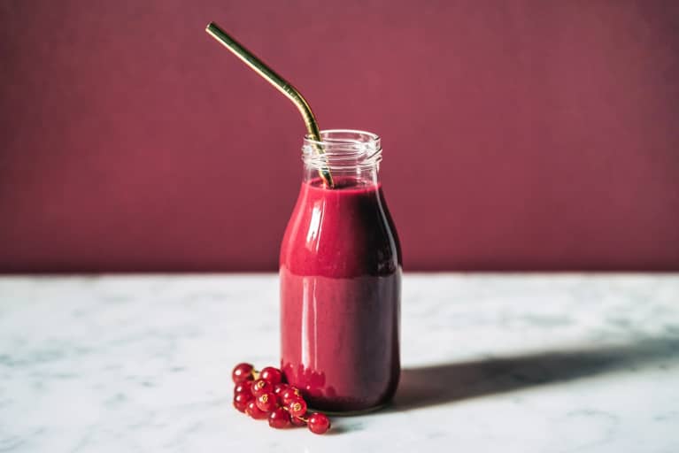 Bottle of Lingonberry Juice with a Reusable Metal Straw