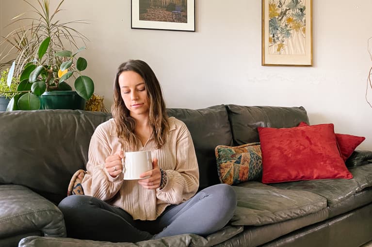 Sarah Regan Sitting in Her Living Room Enjoying a Cup of Tea