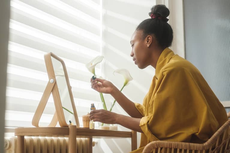Black Woman Doing Skin Care Treatment At Home Black Woman Doing Skin Care Treatment At Home