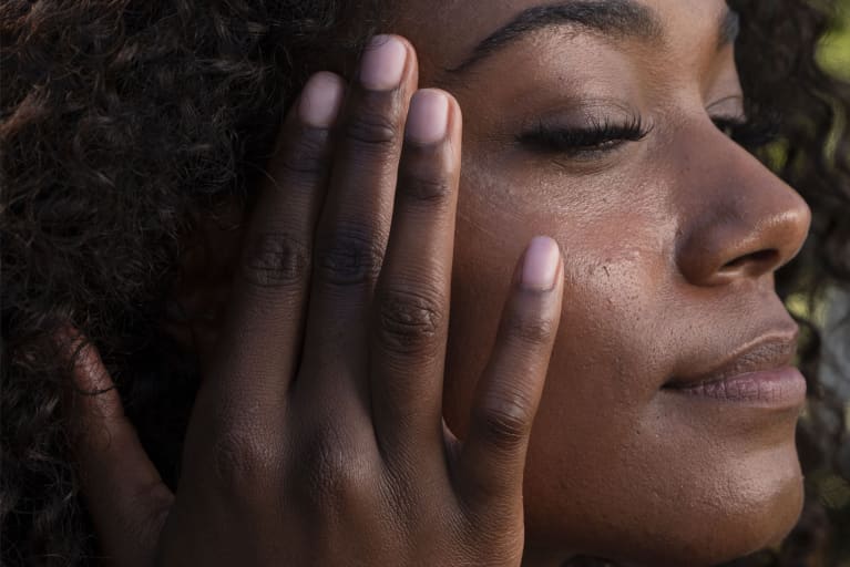 Woman Applying Lotion