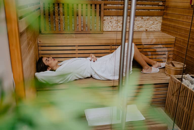 woman laying down in sauna