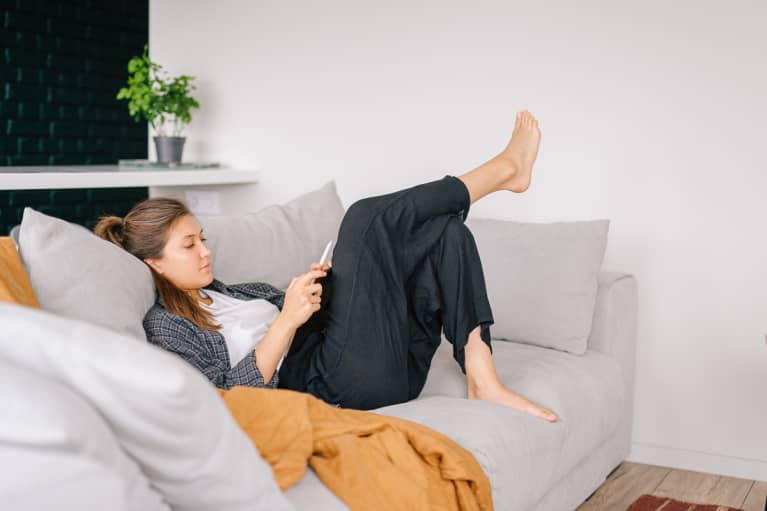 Young Woman Relaxing on the Couch at Home Alone