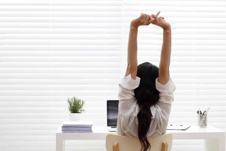 Stuck At Work? 6 Pilates Exercises You Can Do At Your Desk