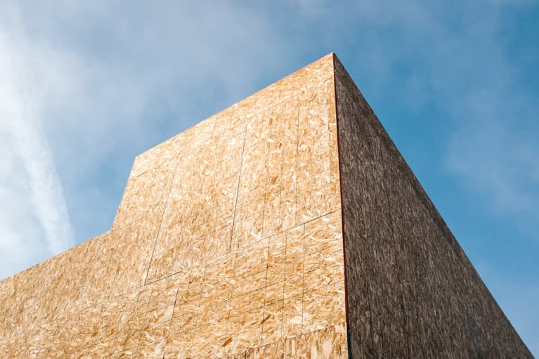 Low angle view of partially completed house under construction, particle board exterior