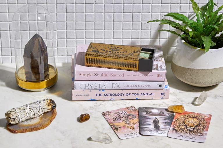 Oracle Cards, Crystals, and Books on a Countertop