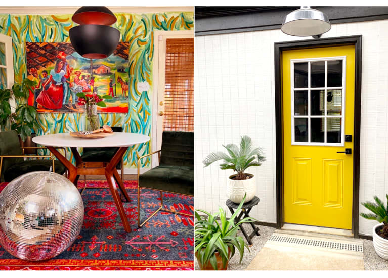 dining room with green wallpaper, red rug, and disco ball