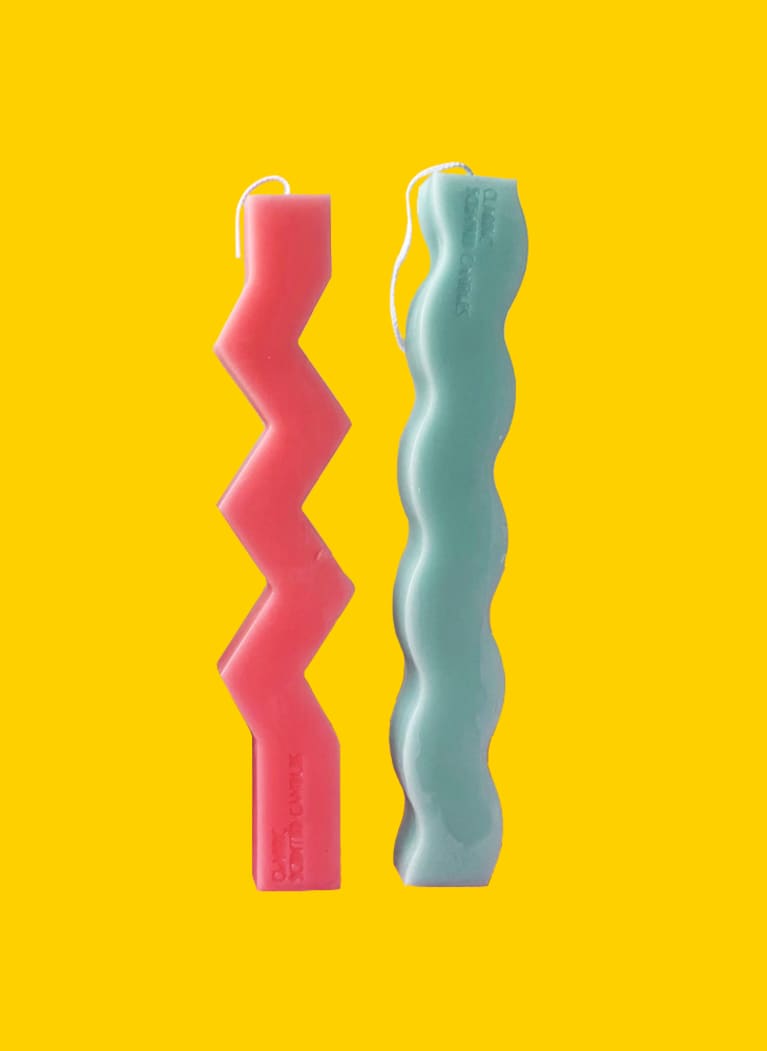 red and blue squiggle-shaped candles