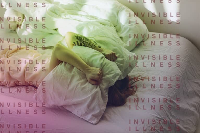 woman lying in bed with pillow over face