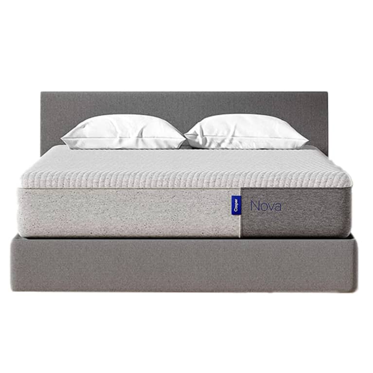 grey bed frame and mattress with white pillows grey bed frame and mattress with white pillows