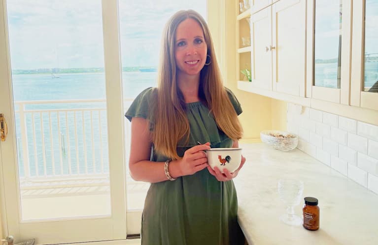woman with mug in front of window woman with mug in front of window