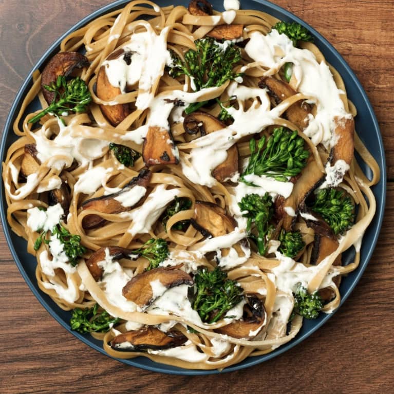 plate of noodles with broccoli alfredo sauce mushroom