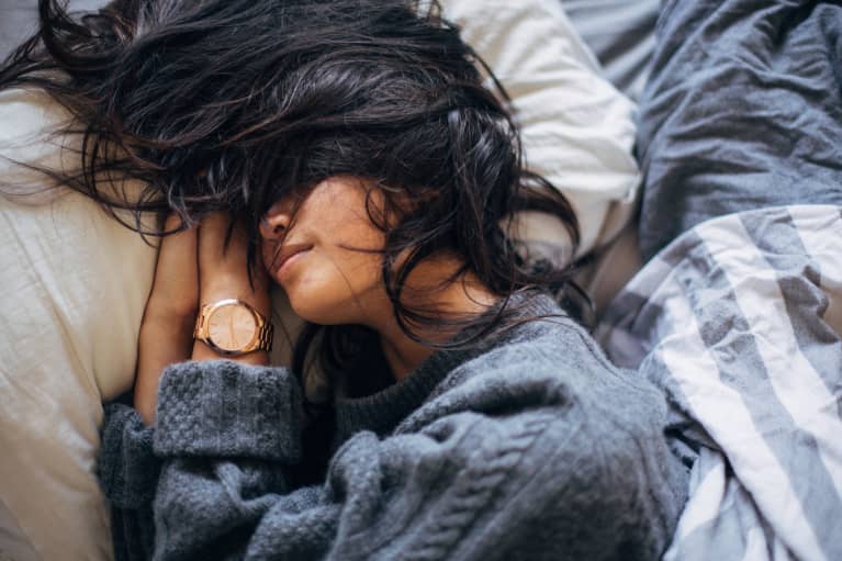 Young asian woman in bed sleeping