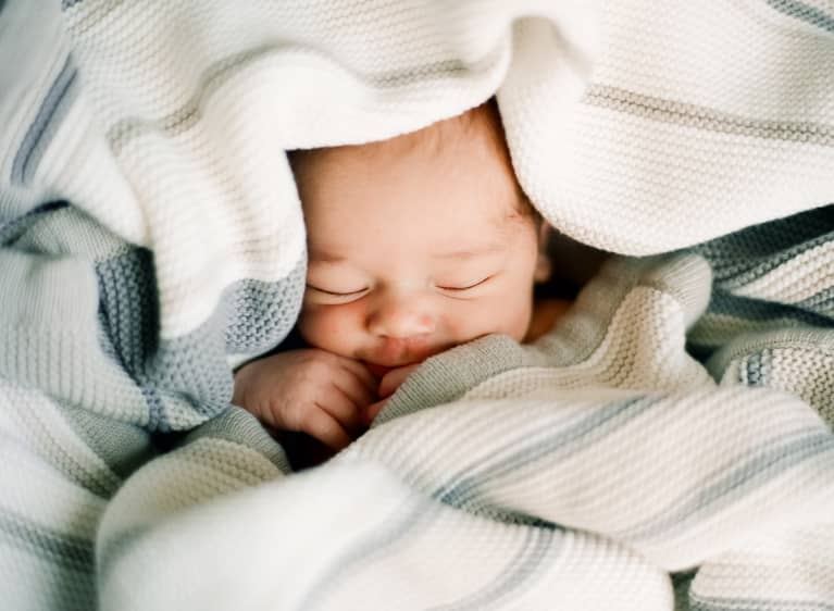Newborn Baby Swaddled in Blankets