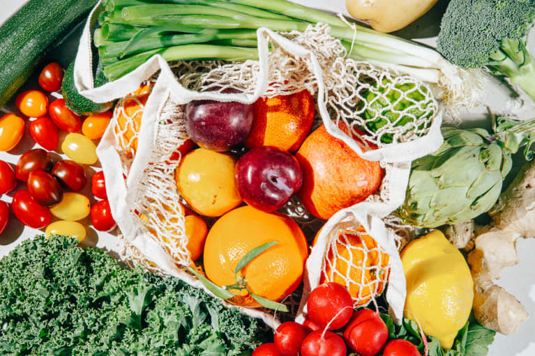 Variety Of Organic Fruits And Vegetables On A Reusable Bag