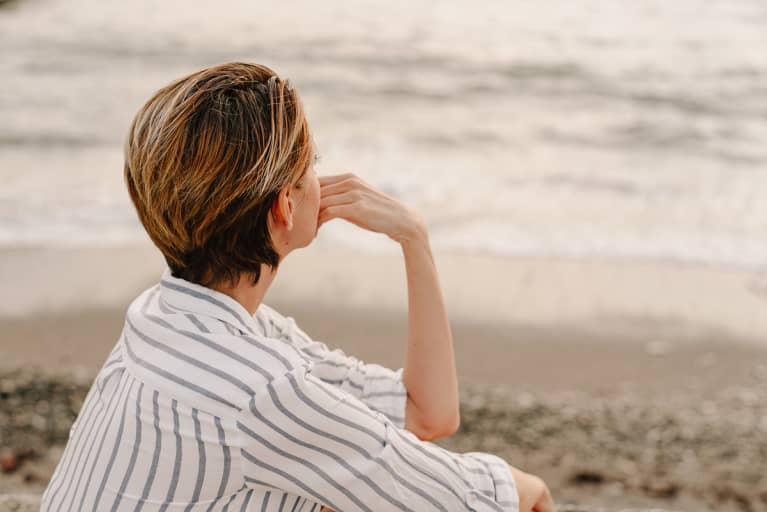 Thoughtful Woman Looking Out at The Water