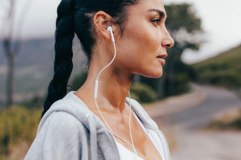 Woman Working Out and Listening to Music