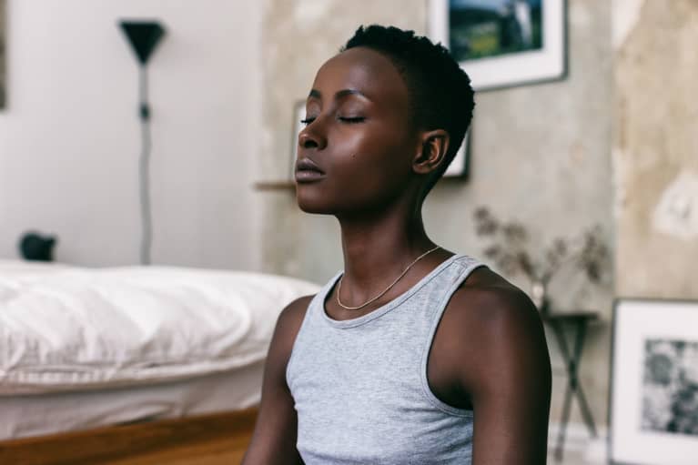 Woman Meditating at Home