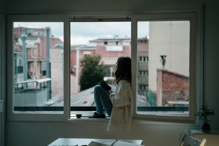 A woman looking out the window.