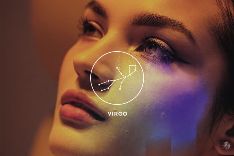 woman looking up to the sky with virgo season symbol overlay