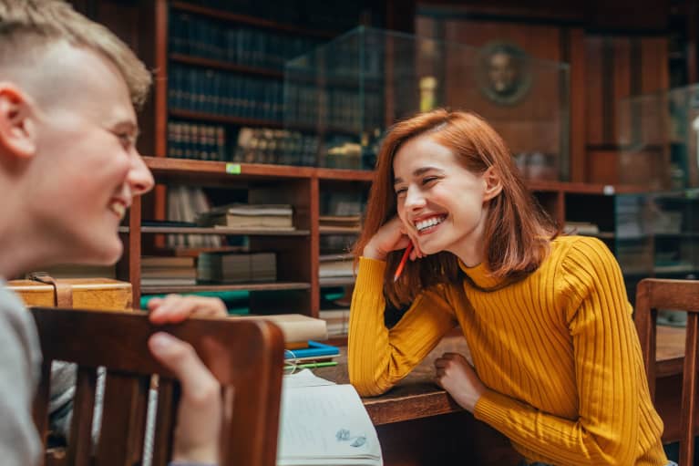 Young Folks Flirting in a Library