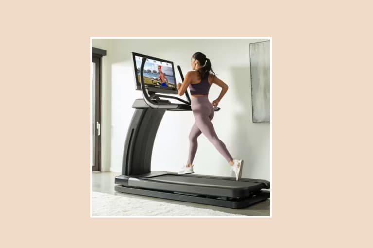 NordicTrack Elite Model with woman running on pink background
