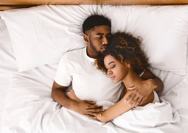 Couple Laying Together in Bed Couple Laying Together in Bed