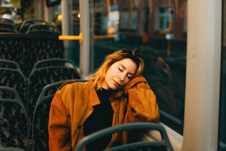 Young Woman Napping on the Commute Home
