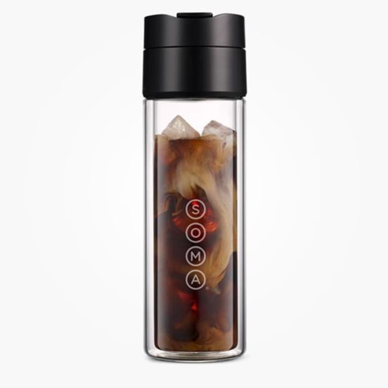 glass coffee thermos with black lid filled with cold brew