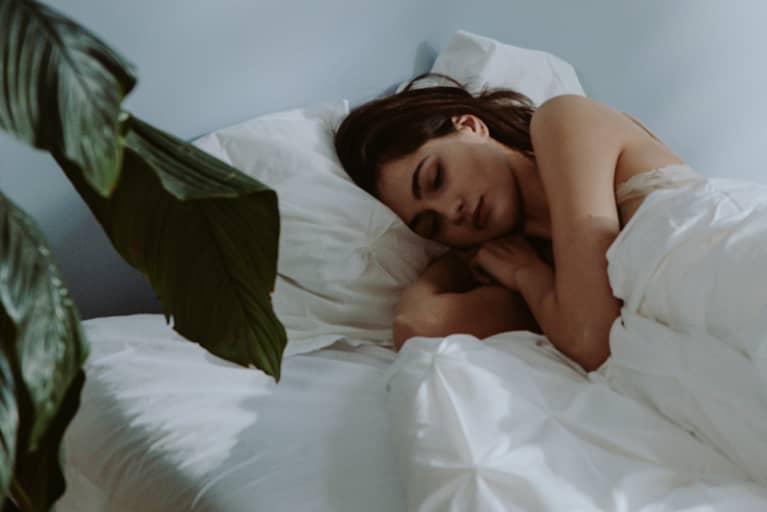 beautiful woman sleeping on bed