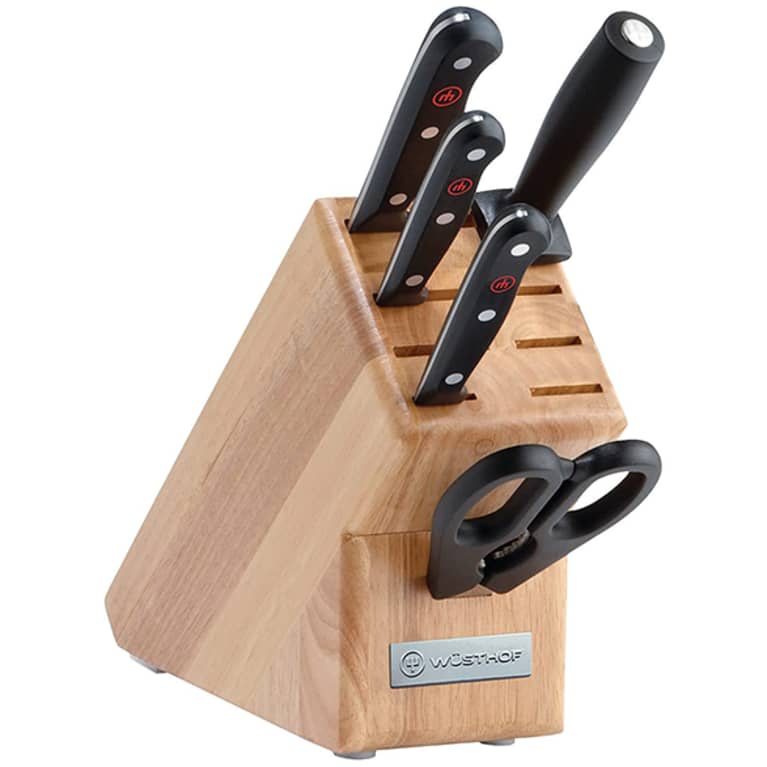 wooden knife block with black knives and pair of shears