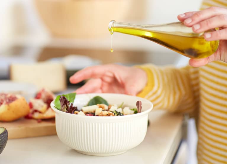 Olive Oil Over a Salad Bowl