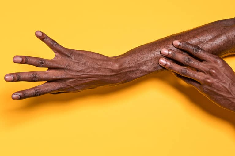 hands on a yellow background 