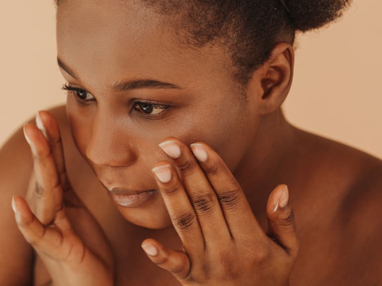 Black Model Apply Toner On Her Face Black Model Apply Toner On Her Face