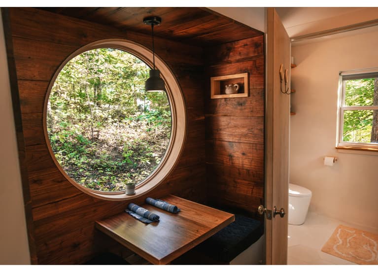 wood-panel room with large circular window wood-panel room with large circular window